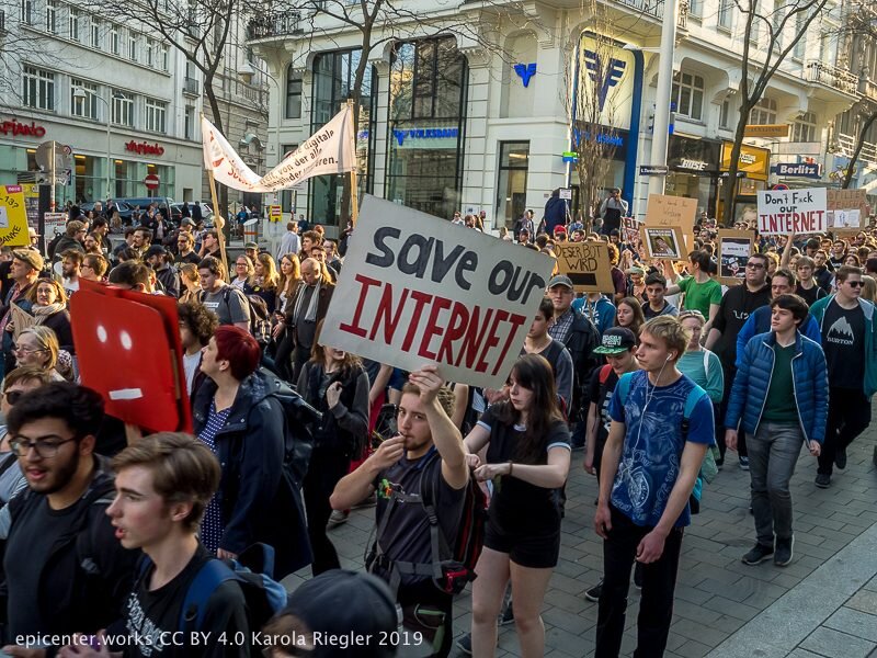 Large crowd marching with a “Save our INTERNET” sign at the 2019 Vienna protest